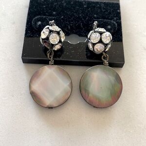 Beautiful crystal and faceted penny sized dangle disc.